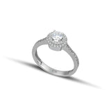 Μονόπετρο δαχτυλίδι γάμου ροζέτα με διαμάντι και πλαϊνές πέτρες brilliant κατασκευασμένο από λευκόχρυσο.