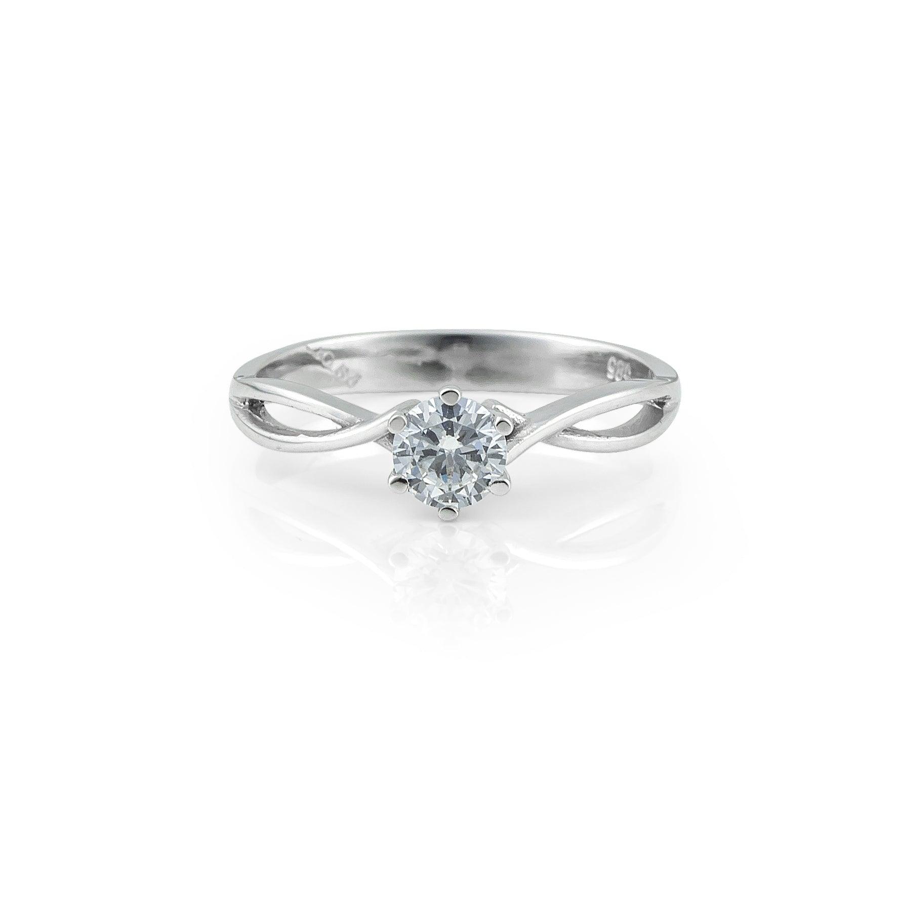 Μονόπετρο δαχτυλίδι γάμου με διαμάντι κατασκευασμένο από λευκόχρυσο, με διαγώνια πλέξη και καστόνι με έξι δόντια. 