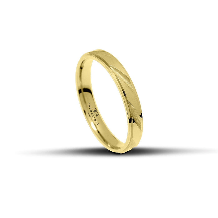 Χρυσές βέρες γάμου με ματ φινίρισμα αμμοβολής, χαράγματα και πλάτος 3.5mm.