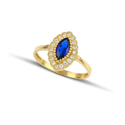Χρυσό δαχτυλίδι Κ14, Οβάλ ροζέτα με λευκά ζιργκόν και μπλε πέτρα στο κέντρο., φορεμένο σε μοντέλο.