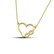 Χρυσό κολιέ Κ14 καρδιά με άπειρο και ζιργκόν, φορεμένο σε μοντέλο.